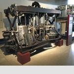 Engine of the steamship RigiSteam engine with oscillating cylinders by Escher, Wyss & Cie.Water-borne craft were amongst the earliest means of transport to be powered by steam. The SS Rigi was fitted with two engines during its working life. The first, dating from 1848, was a 2-cylinder low-pressure steam unit from Penn & Son in London. Horse-drawn carts transported it on the final leg from Schliengen, Germany (near Basel) to Lucerne. In 1894, the entire propulsion system consisting of engine, boiler and paddle wheels was renewed; the cost of doing so came to CHF 40,000. Again equipped with oscillating cylinders for reasons of space, the power plant, supplied by Escher, Wyss & Cie. of Zurich, was of a 2-cylinder wet steam compound design. This increased the speed from 17.3 to 19.7 km/h compared to the earlier engine and reduced coal consumption from 14 to 11 kg/km.